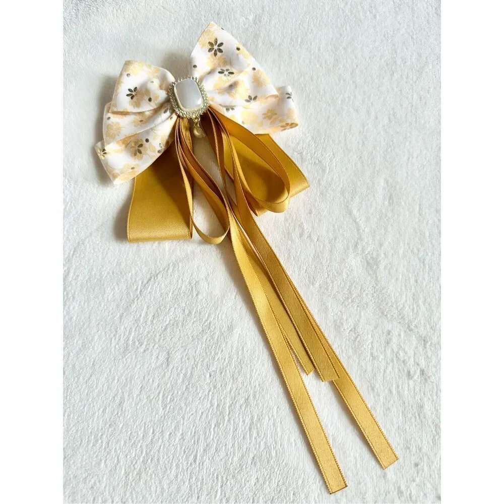 Adorable floral yellow hair bow with floral and pearl accents with hair Barrette